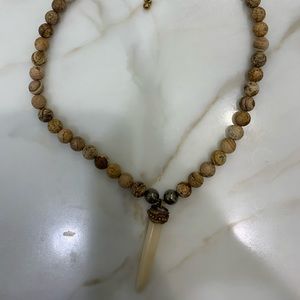 Tan beaded choker with tooth